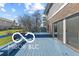 Spacious blue back deck featuring built-in benches and sliding door access to home at 11336 Bloomfield Ct, Indianapolis, IN 46259