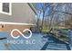 Blue back deck with ample seating and access to the tree-lined backyard at 11336 Bloomfield Ct, Indianapolis, IN 46259