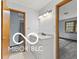Bathroom featuring a single sink with granite countertop and updated lighting fixtures at 11336 Bloomfield Ct, Indianapolis, IN 46259