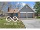 Charming single-story home featuring a brick facade, two-car garage, and well-maintained front yard at 11336 Bloomfield Ct, Indianapolis, IN 46259