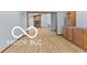 Open-concept living space with hardwood floors and a fireplace at 11336 Bloomfield Ct, Indianapolis, IN 46259