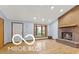 Bright living room featuring a cozy brick fireplace and large bay window at 11336 Bloomfield Ct, Indianapolis, IN 46259