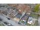 Birds eye view of the home nestled within a vibrant community, showcasing the street and surrounding houses at 1209 N Centennial St, Indianapolis, IN 46222