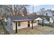 Charming single-story home with freshly painted exterior and covered porch at 1209 N Centennial St, Indianapolis, IN 46222