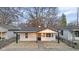 Charming house with white siding, black trim and front porch at 1209 N Centennial St, Indianapolis, IN 46222