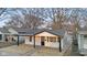 Charming house with white siding, black trim and front porch at 1209 N Centennial St, Indianapolis, IN 46222