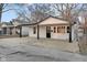 A well-maintained home with a cozy front porch, fresh paint and a neatly kept yard at 1209 N Centennial St, Indianapolis, IN 46222