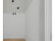 A minimalist laundry room featuring white walls, flooring, and necessary hookups at 1209 N Centennial St, Indianapolis, IN 46222