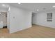 Modern living room with light-colored floors, pristine white walls, and contemporary recessed lighting at 1209 N Centennial St, Indianapolis, IN 46222