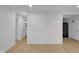 Bright, spacious living area with new floors and fresh white paint throughout the house at 1209 N Centennial St, Indianapolis, IN 46222