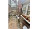 Backyard patio with brick surface, potted plants, and gated fence at 1230 Kessler Blvd E Dr, Indianapolis, IN 46220