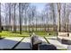 Spacious backyard featuring a wooded area and pond view perfect for nature lovers at 1355 Forest Hills Dr, Westfield, IN 46074