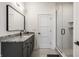 Sleek bathroom with modern vanity, frameless mirror, and tiled shower at 1355 Forest Hills Dr, Westfield, IN 46074