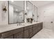 Modern bathroom with double vanity, large mirrors, and a glass-enclosed shower with marble tile at 1355 Forest Hills Dr, Westfield, IN 46074