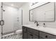Contemporary bathroom with stylish vanity, mirror, and glass-enclosed shower at 1355 Forest Hills Dr, Westfield, IN 46074