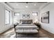 Light and airy bedroom with large windows, neutral colors, and comfortable furnishings at 1355 Forest Hills Dr, Westfield, IN 46074