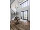 Inviting foyer with high ceilings, hardwood floors, and modern lighting at 1355 Forest Hills Dr, Westfield, IN 46074
