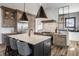 The kitchen features an island with a marble countertop, stainless steel appliances, and custom wood cabinets at 1355 Forest Hills Dr, Westfield, IN 46074
