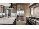 A chef's kitchen features stainless steel appliances, marble countertops, and custom cabinets, perfect for entertaining at 1355 Forest Hills Dr, Westfield, IN 46074