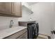 Well-organized laundry room with modern washer and dryer and plenty of storage at 1355 Forest Hills Dr, Westfield, IN 46074