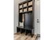 Mudroom with built-in storage, bench, hooks, and decorative baskets near the entry door at 1355 Forest Hills Dr, Westfield, IN 46074