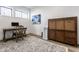 Well lit home office featuring wooden desk, decor, and floors, with a white accent wall and stylish rug at 1355 Forest Hills Dr, Westfield, IN 46074