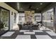 Covered patio features an outdoor fireplace, seating area, and dining table with seating at 1355 Forest Hills Dr, Westfield, IN 46074