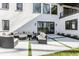 Backyard patio offers a relaxing seating area with an outdoor sofa and lounge chairs at 1355 Forest Hills Dr, Westfield, IN 46074