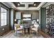 Elegant wine cellar with custom shelving and comfortable seating area at 1355 Forest Hills Dr, Westfield, IN 46074