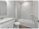 Bathroom features a white vanity, toilet, and tub-shower with tiled walls at 14859 Amber Light Dr, Westfield, IN 46074