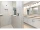 Modern bathroom showcasing a glass-enclosed shower and a double sink vanity with granite countertops, offering a spa-like experience at 14859 Amber Light Dr, Westfield, IN 46074