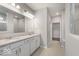 Bright bathroom with double sink vanity, granite countertops, and ample storage space, creating a luxurious and functional area at 14859 Amber Light Dr, Westfield, IN 46074