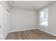 Bright bedroom featuring wood-look floors and a window overlooking the outdoors at 14859 Amber Light Dr, Westfield, IN 46074