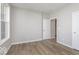 A bright bedroom with light-gray walls, wood-look flooring, and a window at 14859 Amber Light Dr, Westfield, IN 46074