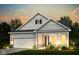 Charming exterior view of a home featuring white siding, a manicured lawn, and a two-car garage at 14859 Amber Light Dr, Westfield, IN 46074