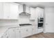 White kitchen featuring stainless appliances, herringbone backsplash, and shaker style cabinets at 14859 Amber Light Dr, Westfield, IN 46074
