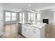 Open concept kitchen with island, stainless steel appliances, and view to living area at 14859 Amber Light Dr, Westfield, IN 46074