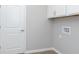 Laundry room featuring overhead cabinets and connections for a washer and dryer at 14859 Amber Light Dr, Westfield, IN 46074