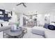 Open-concept layout featuring a living room with modern furniture and a kitchen with bar seating at 14859 Amber Light Dr, Westfield, IN 46074