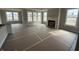 Spacious living room featuring abundant natural light from large windows and a fireplace at 14859 Amber Light Dr, Westfield, IN 46074