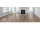 Bright living room featuring a fireplace and lots of natural light from the large windows at 14859 Amber Light Dr, Westfield, IN 46074