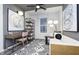 Modern home office with stylish decor, including a desk, shelving, and comfortable seating at 14859 Amber Light Dr, Westfield, IN 46074