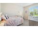 Cozy bedroom with a soft color scheme, featuring natural light from the window at 15773 Eastpark Dr, Noblesville, IN 46060