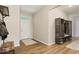 Bright entryway featuring hardwood floors, a coat rack, and a stylish bench with storage at 15773 Eastpark Dr, Noblesville, IN 46060