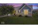 Lovely home with well manicured lawn, front garden, and brick and siding exterior at 15773 Eastpark Dr, Noblesville, IN 46060