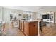Spacious living area with kitchen island and dining area featuring an open-concept layout at 15773 Eastpark Dr, Noblesville, IN 46060