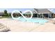 Community pool and recreation area with plenty of lounge chairs at 15773 Eastpark Dr, Noblesville, IN 46060