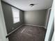 This bedroom features neutral walls, carpet, and a window for natural light at 1618 W 17Th St, Anderson, IN 46016