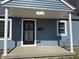 Close up of the covered front porch with support columns and visible house number at 1618 W 17Th St, Anderson, IN 46016