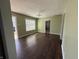 The hardwood floor is highlighted in this bright and open living room at 1618 W 17Th St, Anderson, IN 46016